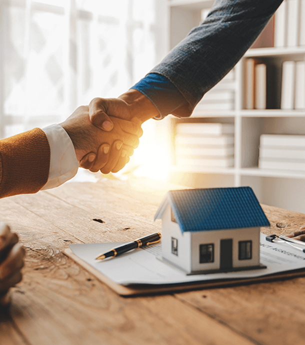 Advisor explaining adjustable-rate mortgage terms to couple at kitchen table