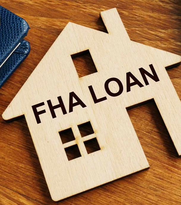 First-time home buyer couple discussing FHA loan options with mortgage advisor