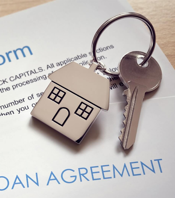 Family walking along driveway toward modest farmhouse purchased with USDA loan