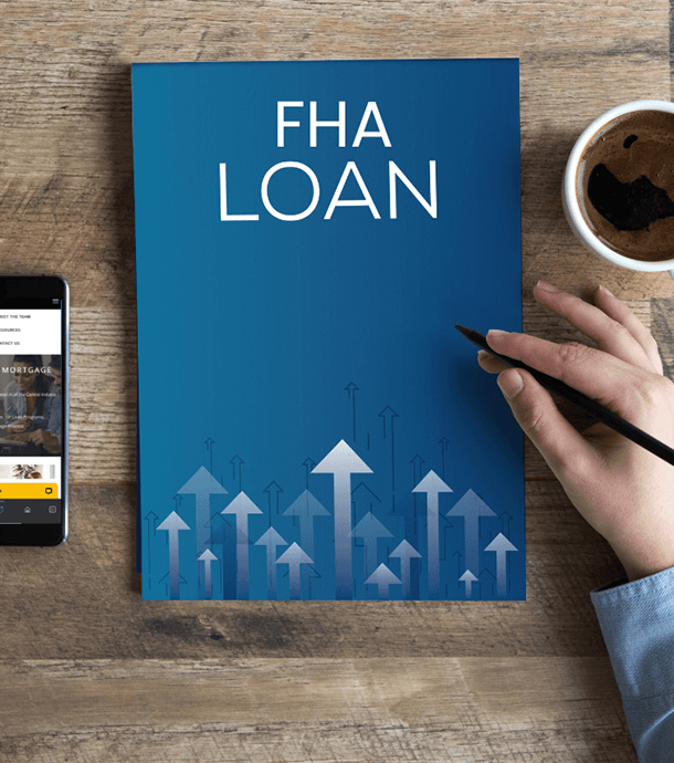 Hands holding approved FHA loan application form beside pen and notepad