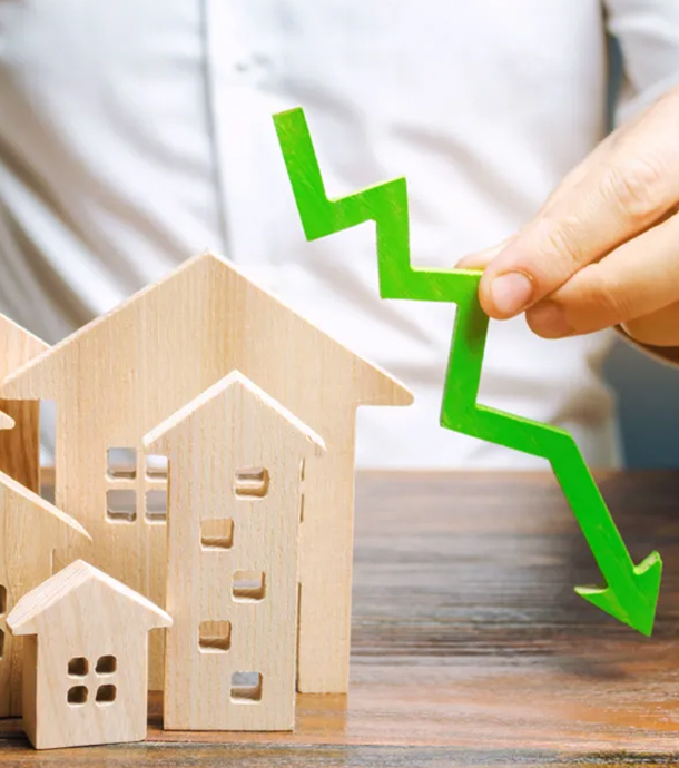Young couple reviewing fixed-rate mortgage documents with loan officer at desk